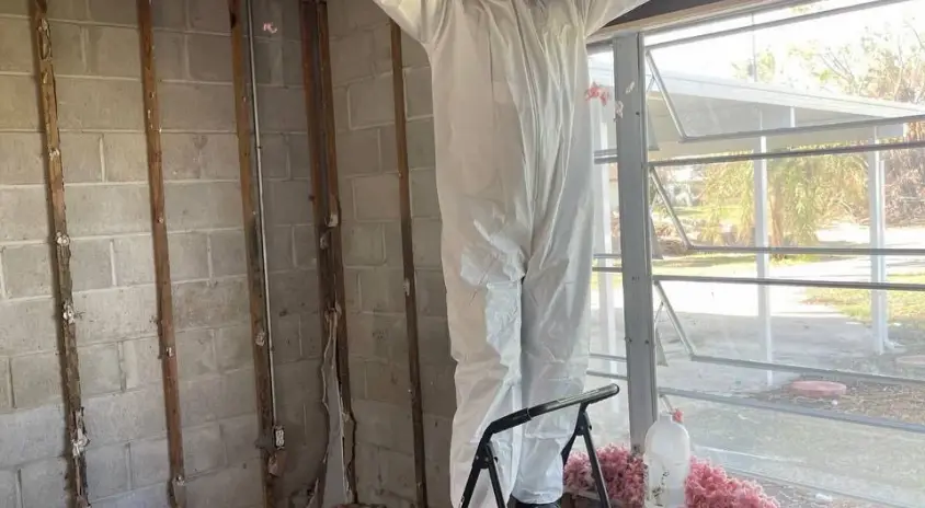 Ceiling demolition during professional property restoration after water damage in Hollywood, FL