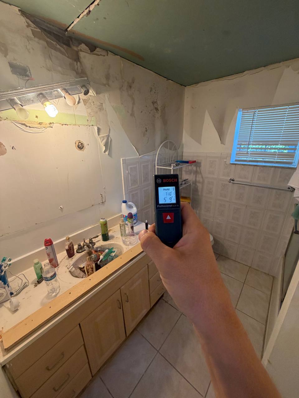 Severe bathroom wall mold damage and inspection in Miami