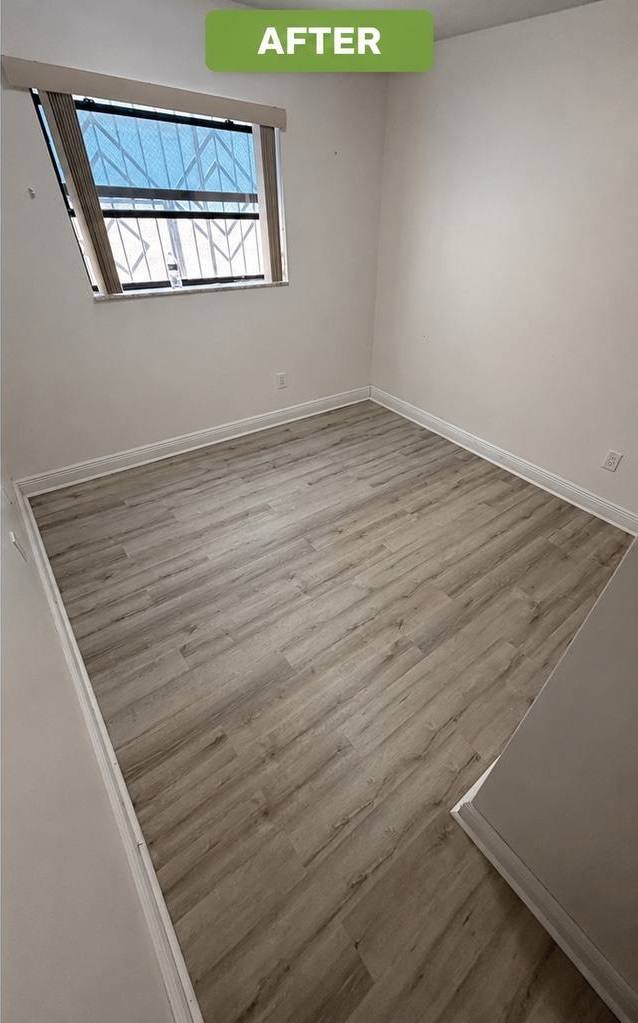 Fully restored kitchen living area with new vinyl plank flooring