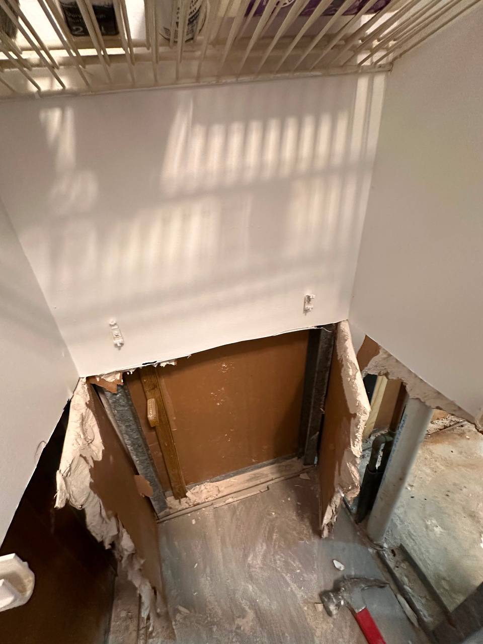 Removal of mold-contaminated drywall inside wall cavity