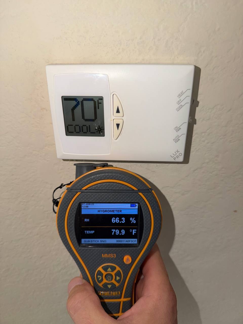 Measuring indoor relative humidity and ambient temperature near thermostat with hygrometer