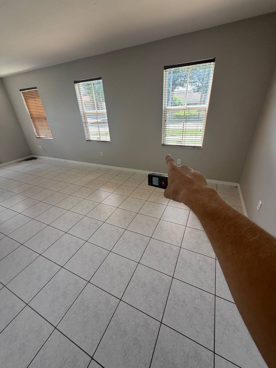 Using moisture meter to check interior drywall saturation levels