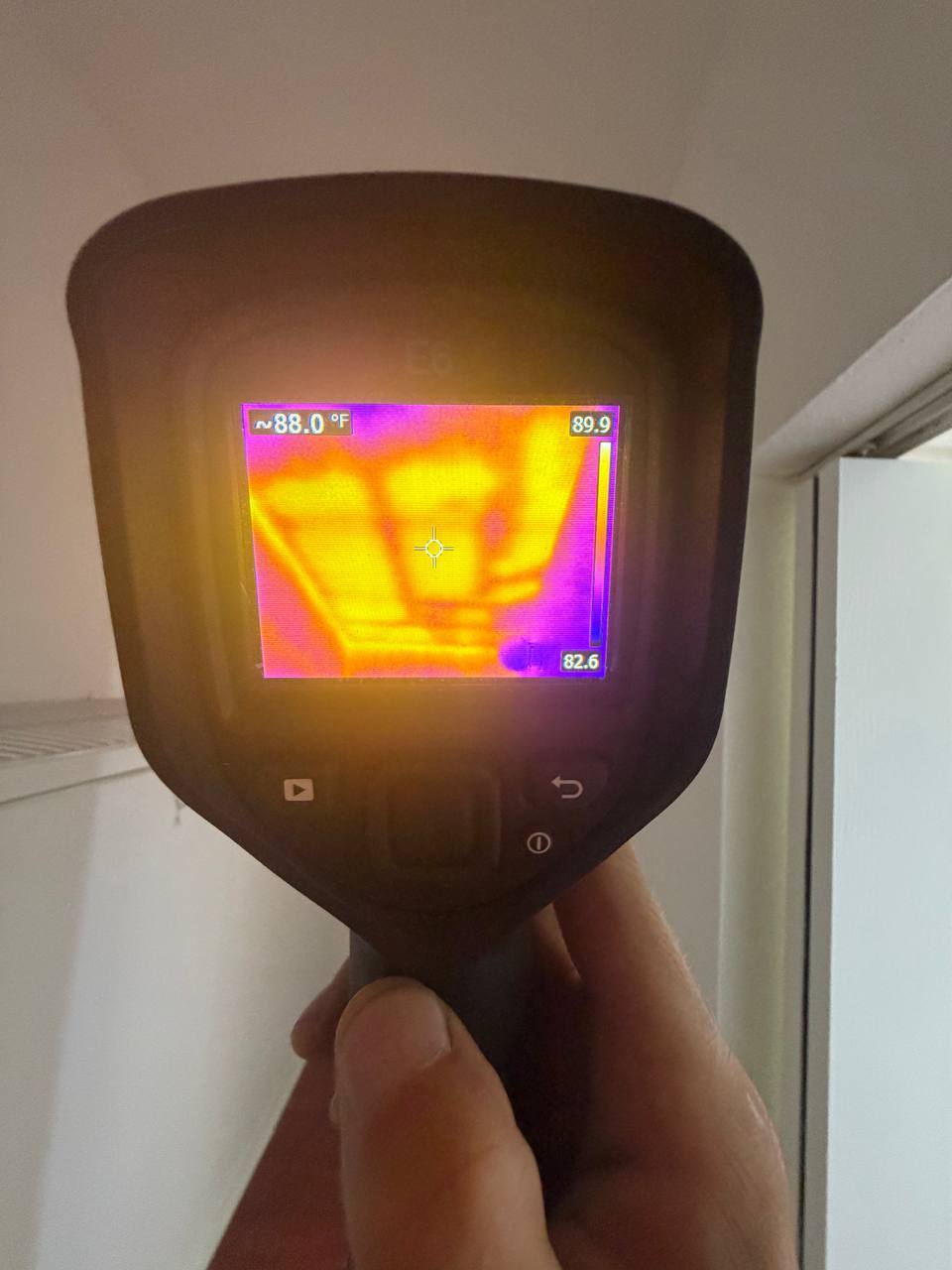 FLIR thermal camera imaging showing temperature differentials on ceiling and wall