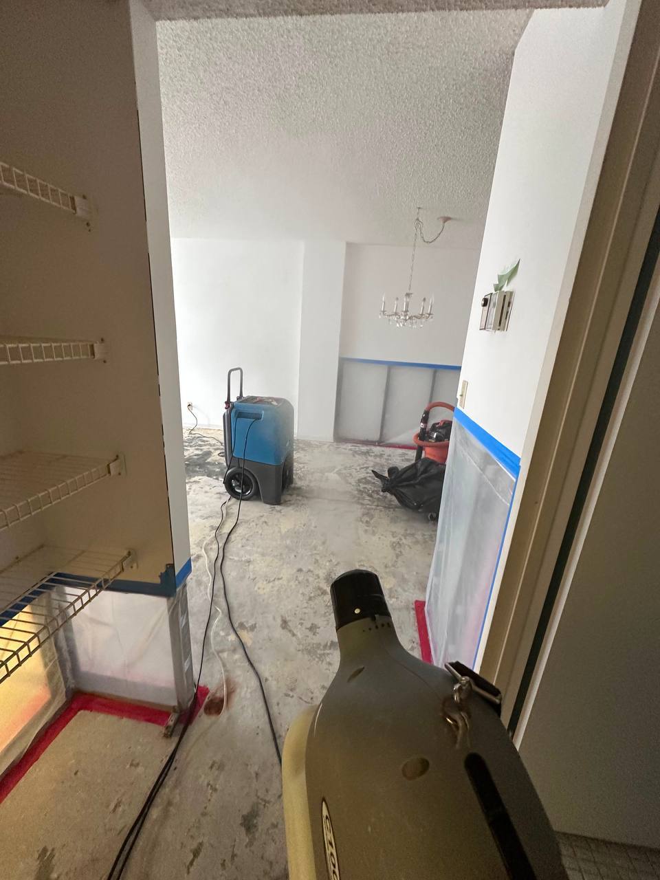 Applying antimicrobial fogging treatment across remediated containment area