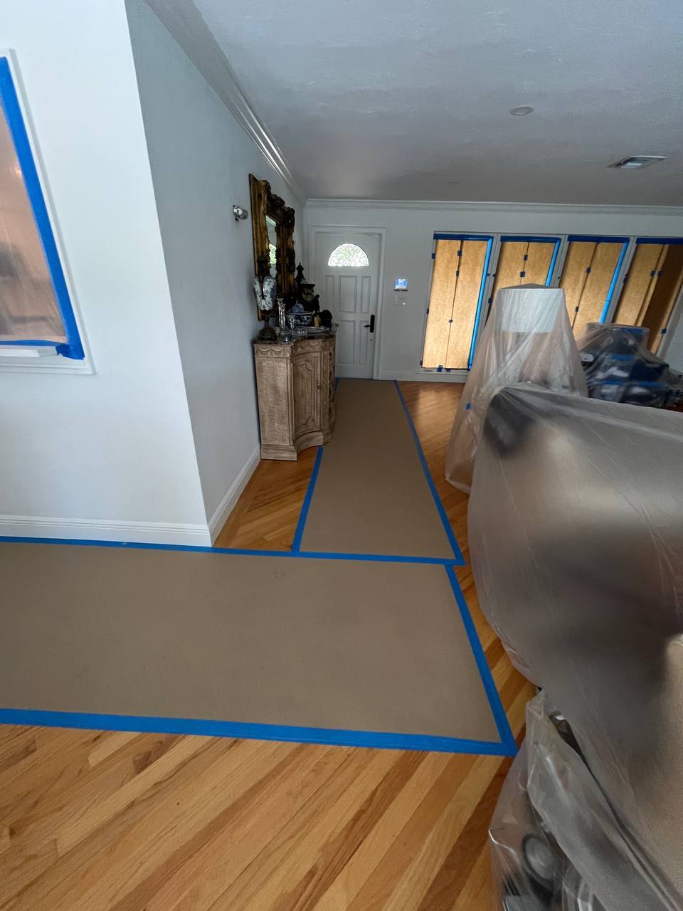 Floor and furniture protection setup for mold containment on Abbott Ave in Surfside