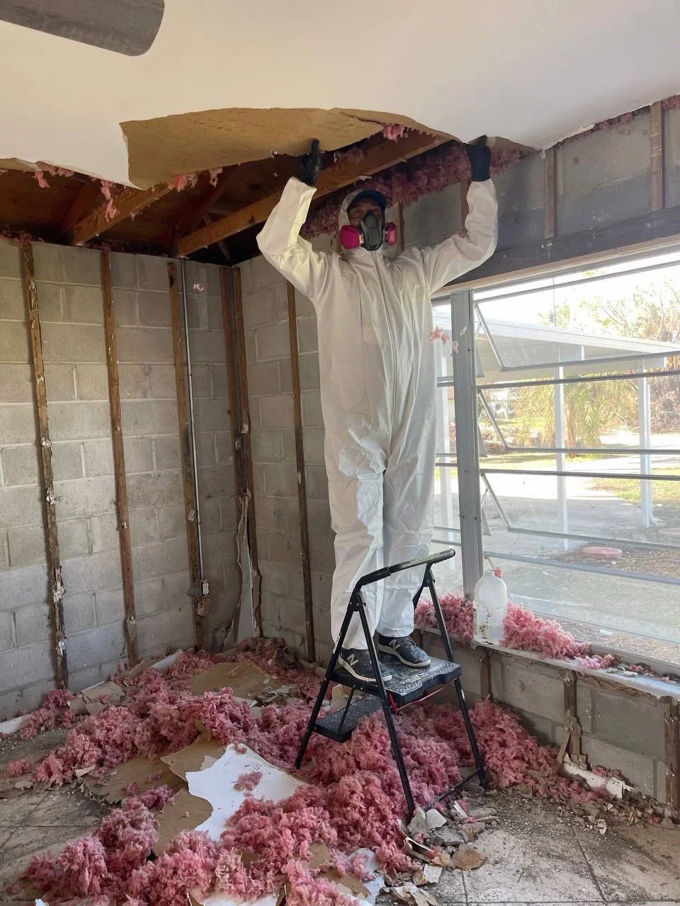 Ceiling demolition during professional property restoration after water damage in Hollywood, FL