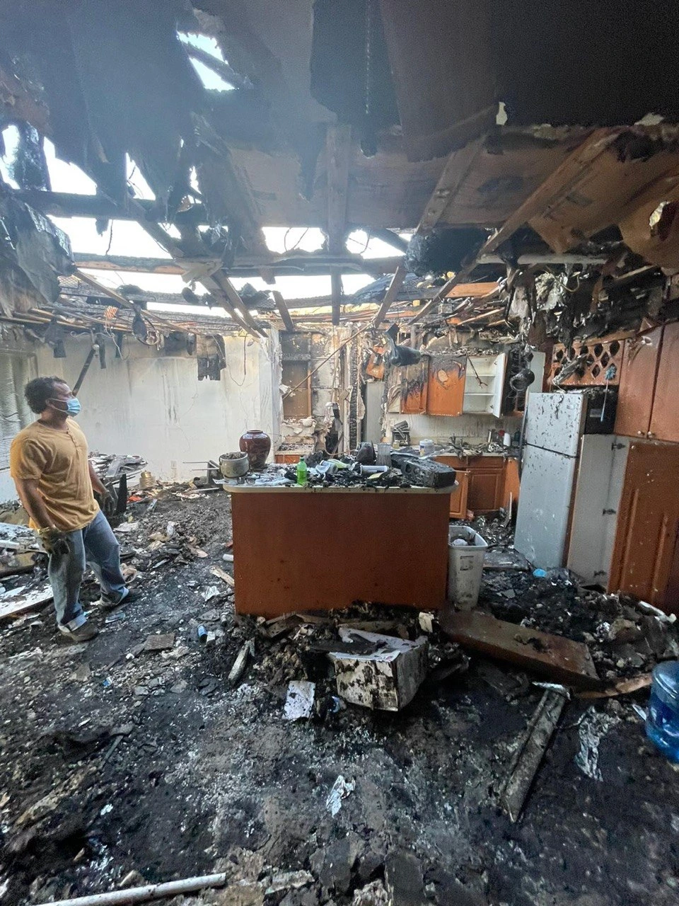 Fire damage restoration team documenting smoke and soot damage