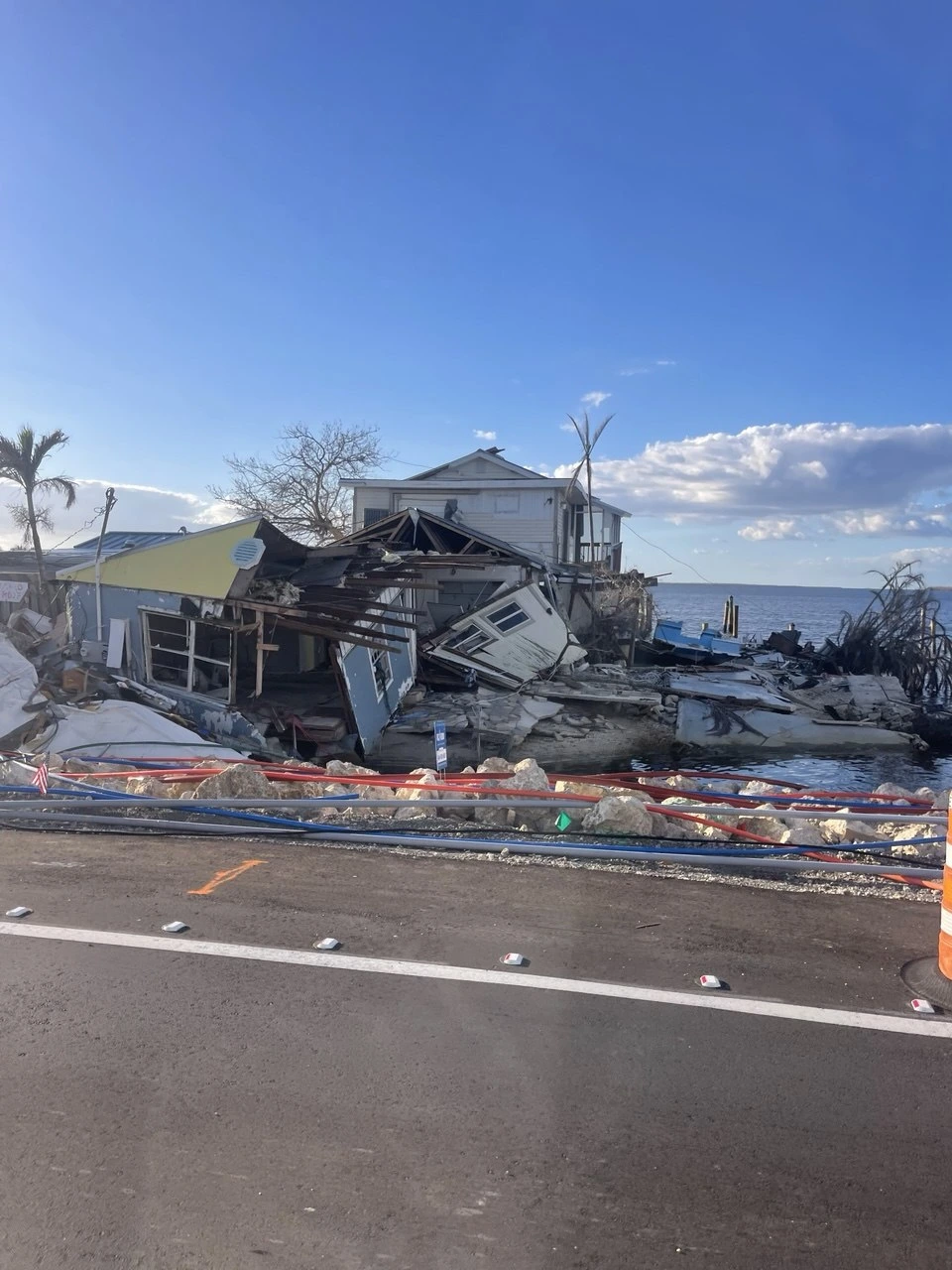 Storm damage restoration equipment responding after hurricane water intrusion